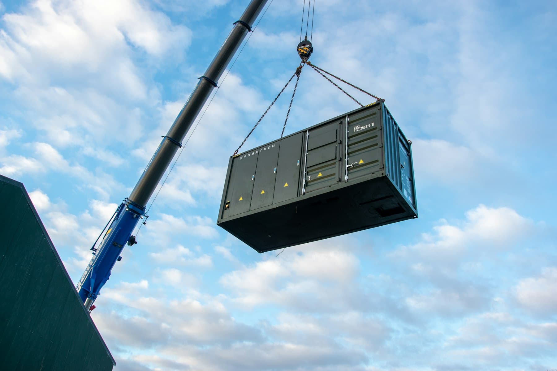 Crane lifting a large load against the sky