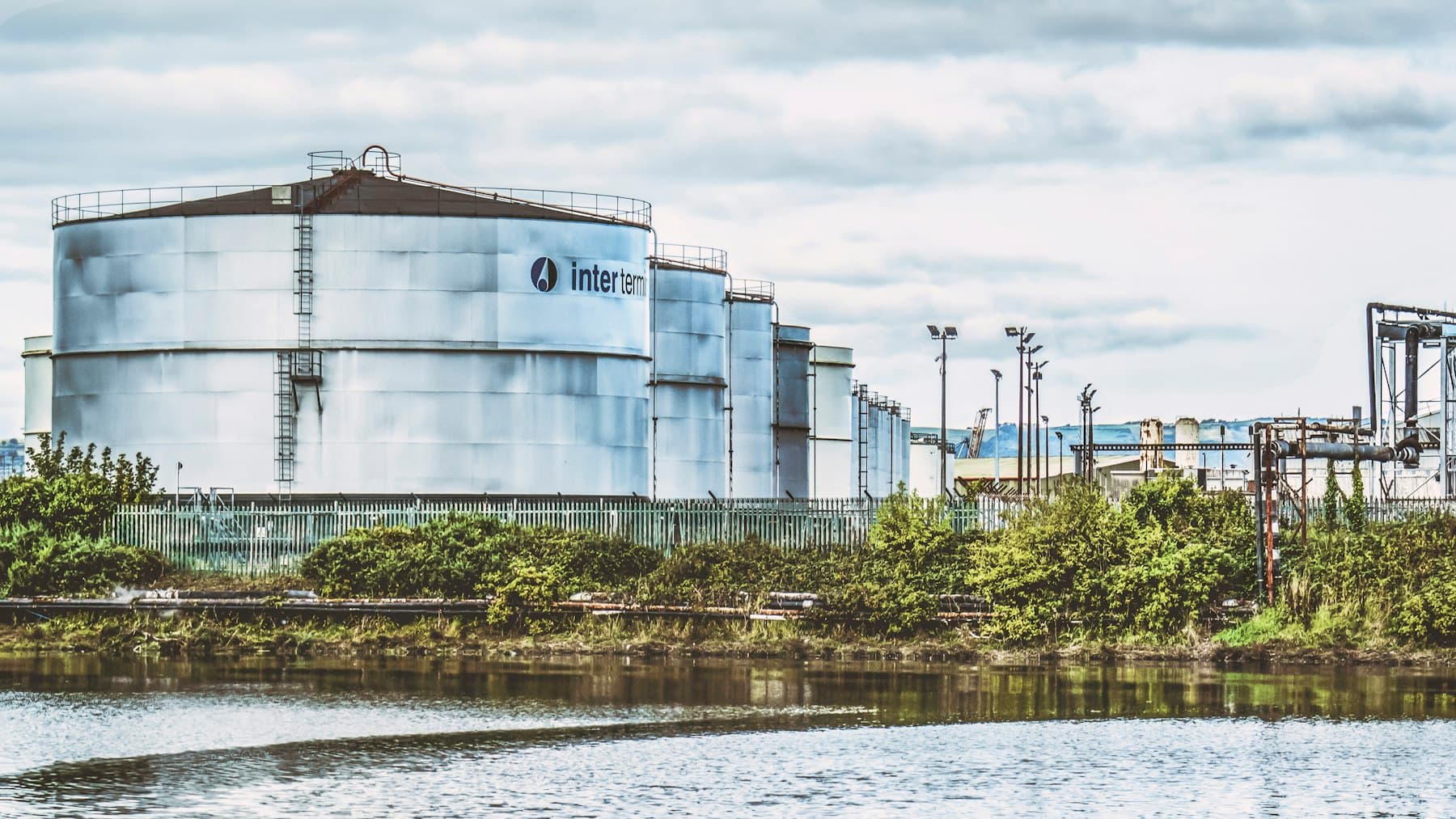 Large industrial plant beside a body of water